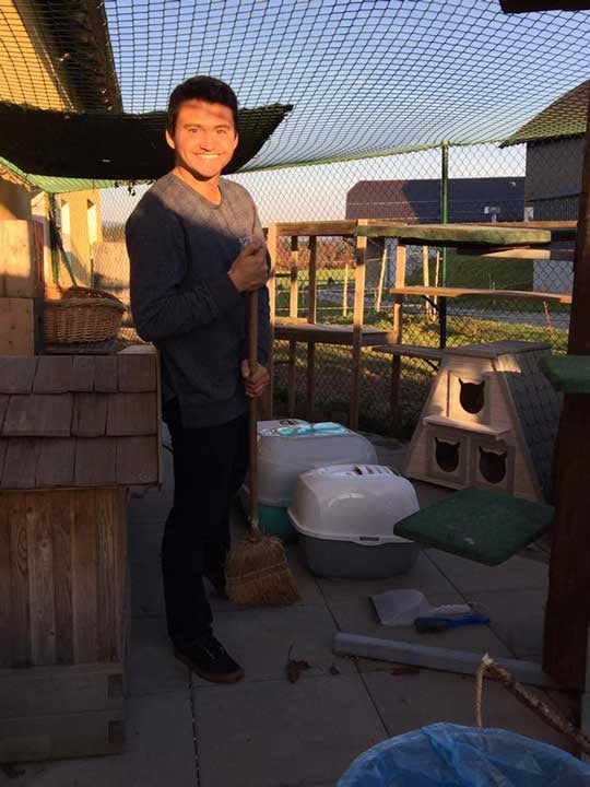 a man holding a broom