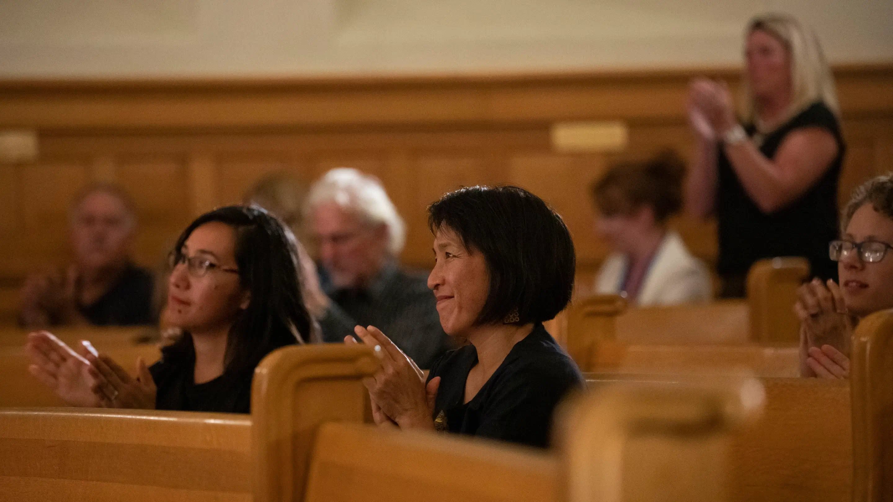a group of people sitting in pews