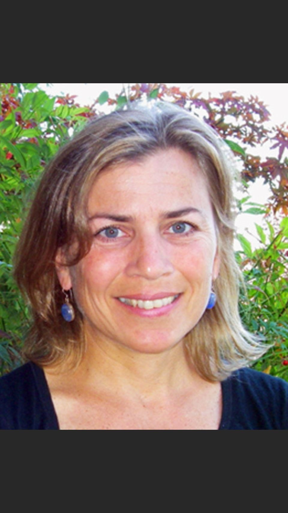 a close-up of a woman smiling