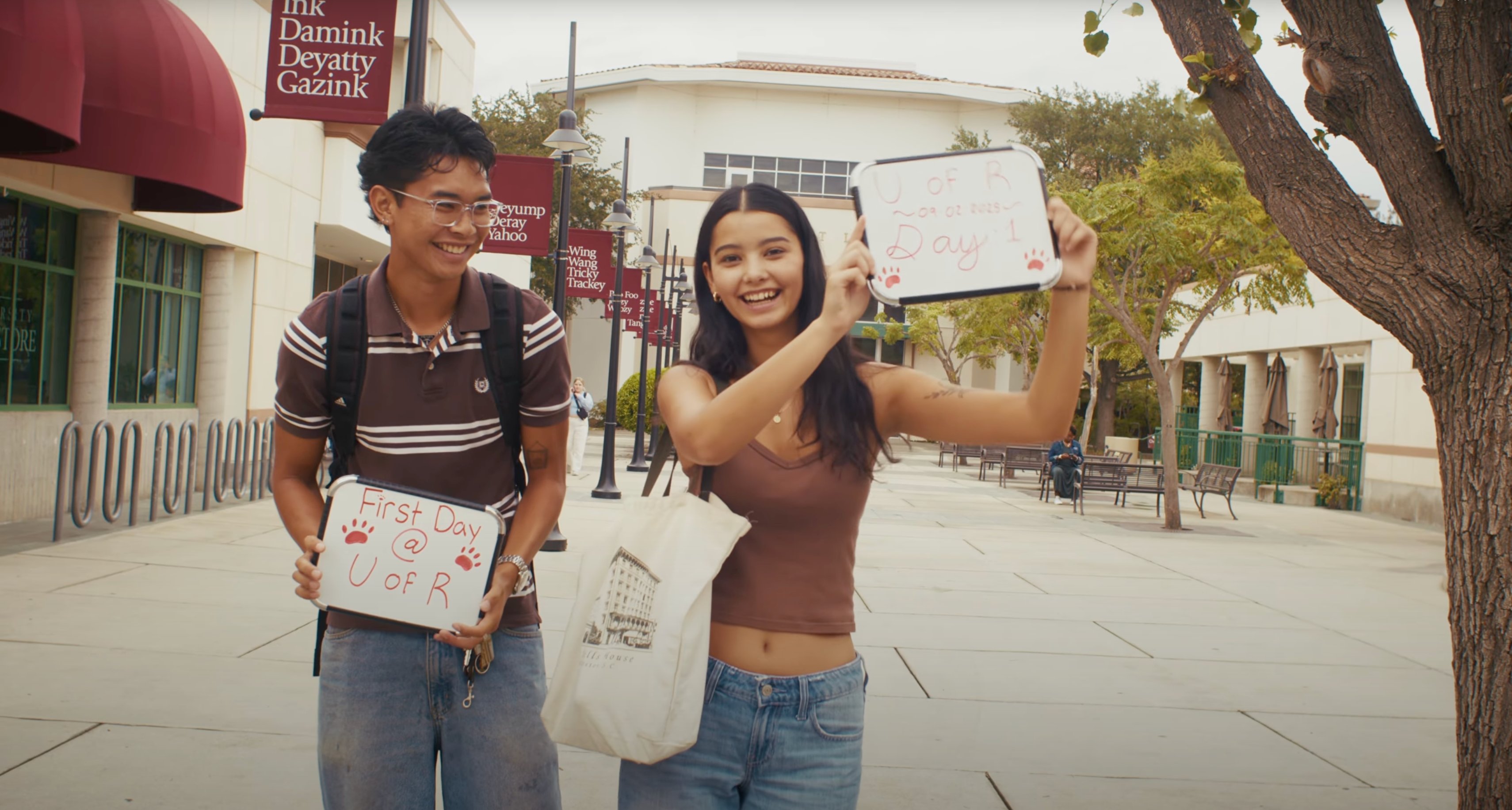 a person and person holding signs