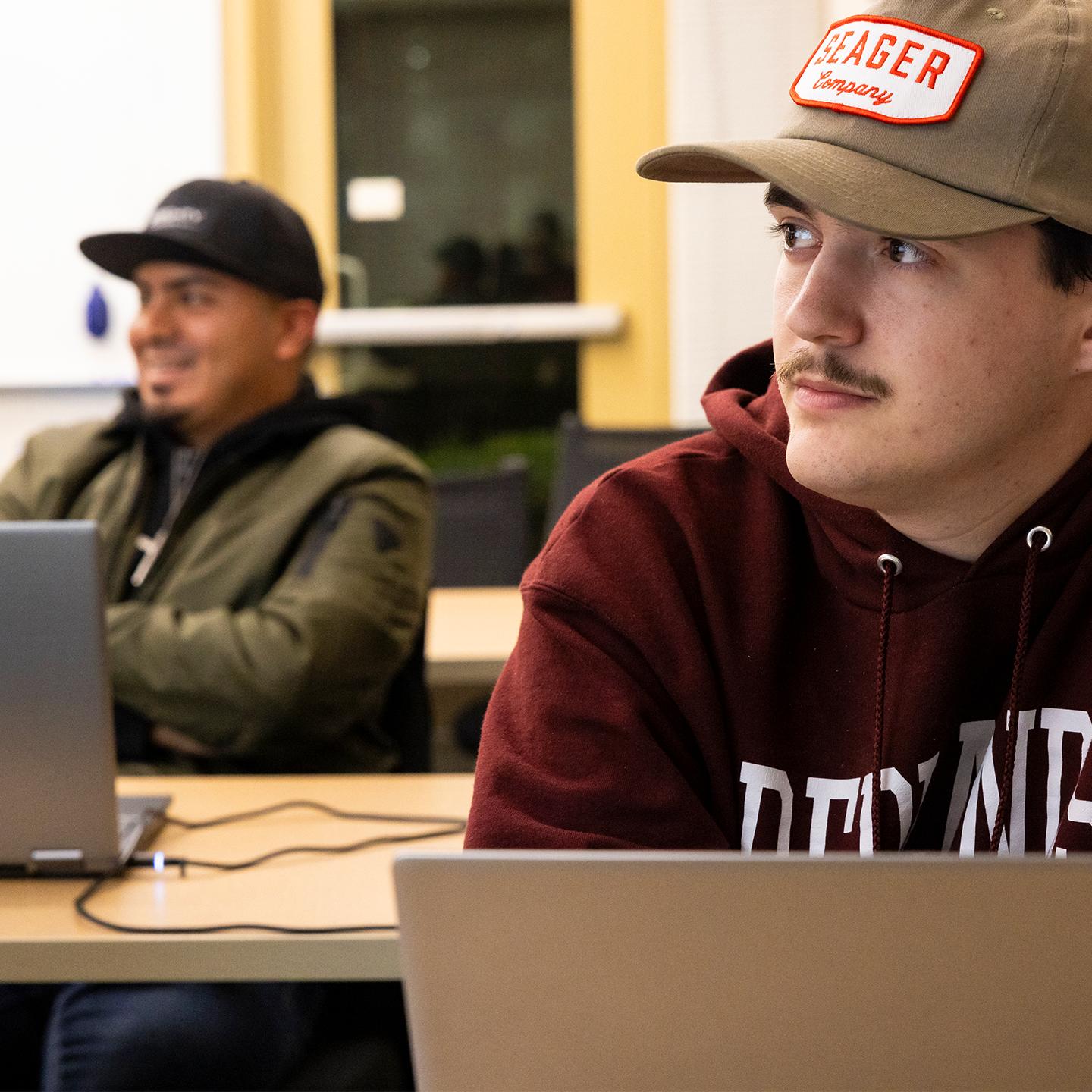 Media card - Graduate GIS students learning in class