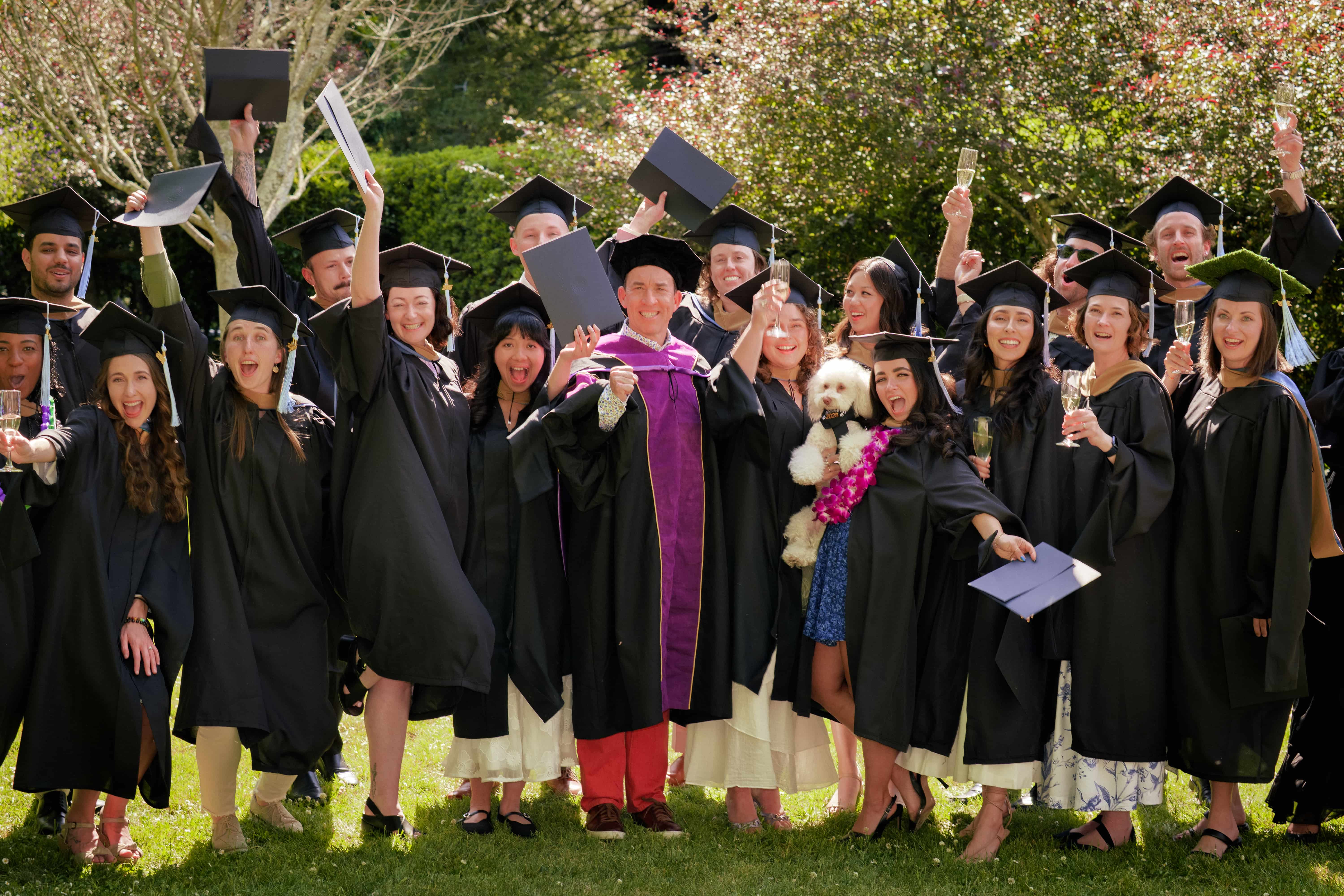 The Class of 2025 is taking a group photo cheerfully.