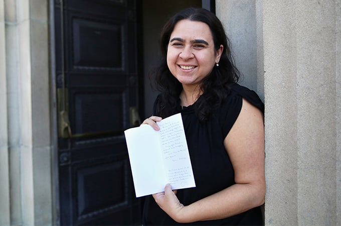 Laura Gallardo holding the letter the 