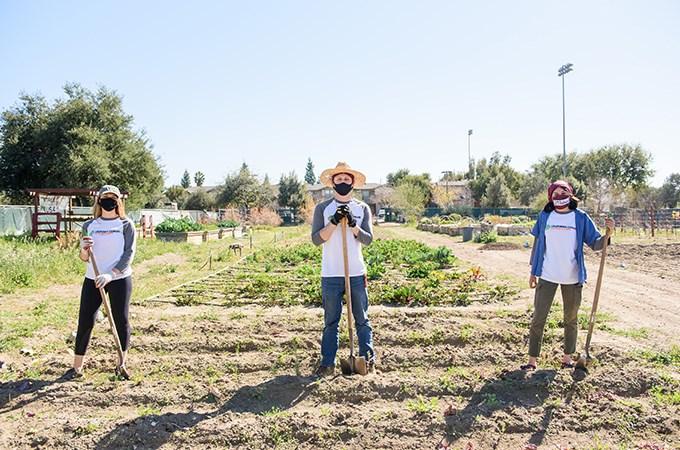 Climate Action Corps fellows Helena Candaele, Bryan Miranda, and Jennifer Solis ’21 (left to right) are helping to advance the University’s new urban forest project using Sustainable University of Redlands Farm land. (Photo by Coco McKown ’04, ’10)