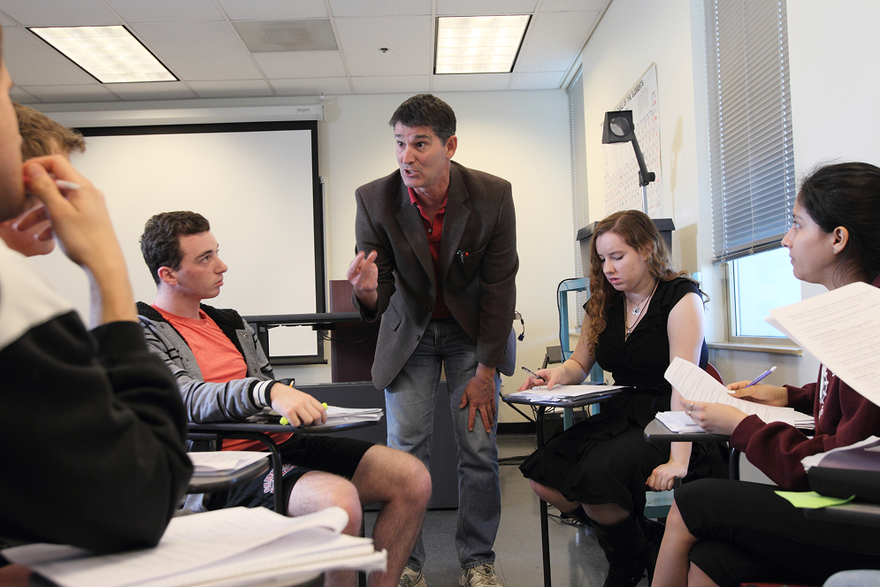 a man standing in front of a group of people