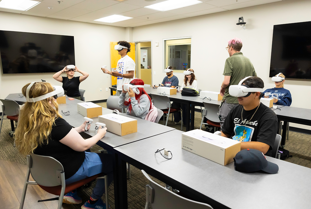 a group of people in a room with white headsets